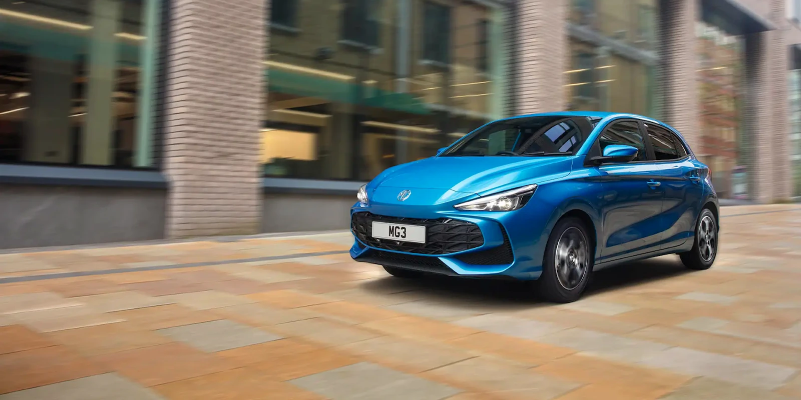 Blue MG3 Hybrid+ being driven through a city